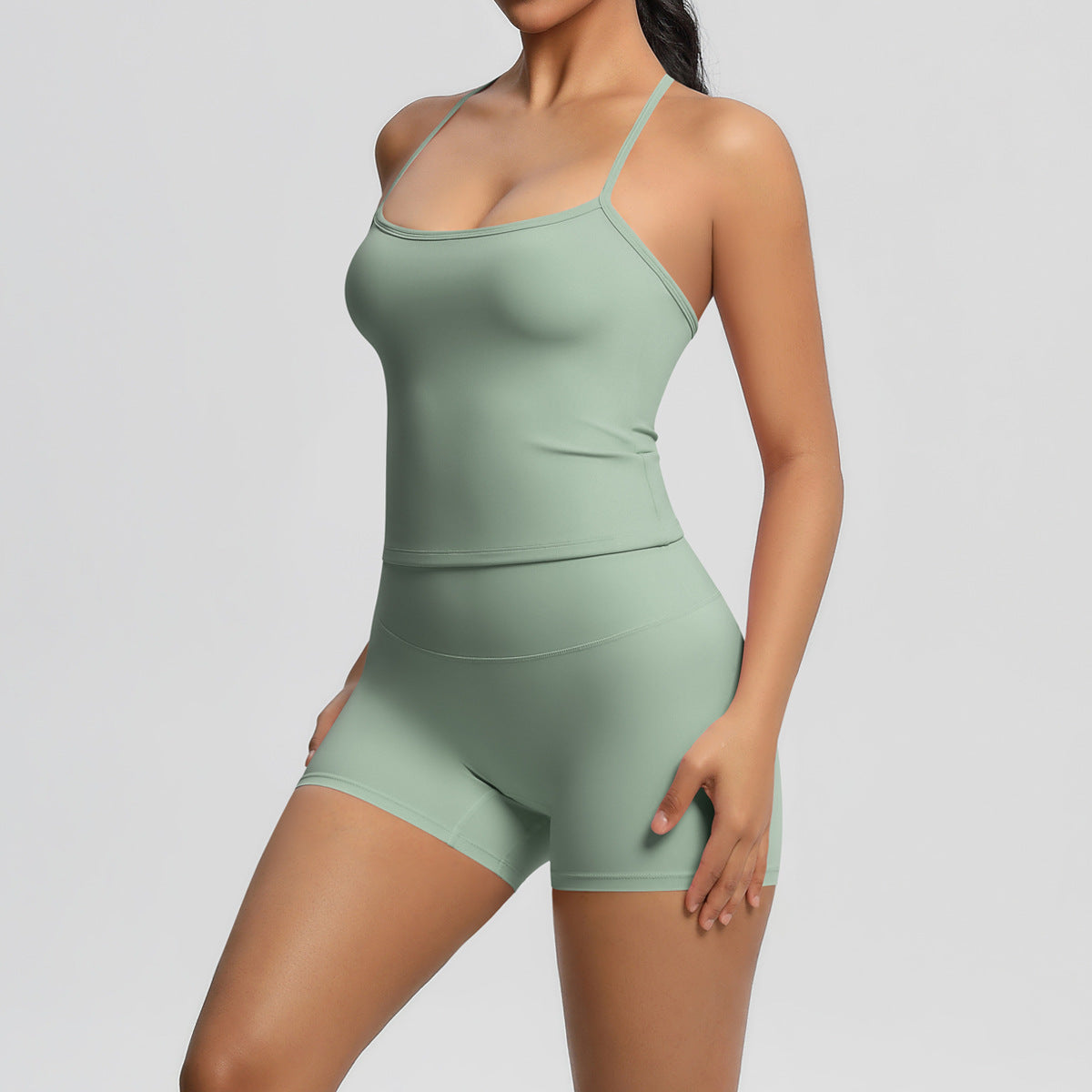 Conjunto de dos piezas de camiseta sin mangas informal con espalda descubierta y pantalones cortos ajustados para mujer