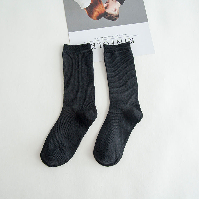 Calcetines de tubo de color liso sencillos a la moda para mujer