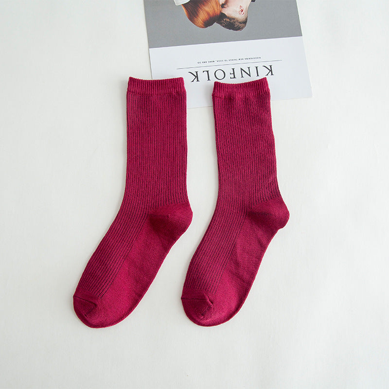 Calcetines de tubo de color liso sencillos a la moda para mujer