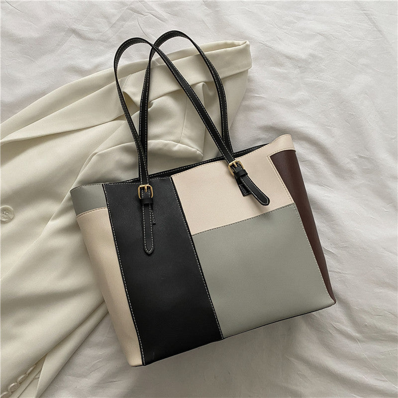 Bolso de mano de gran capacidad con costuras de moda en color