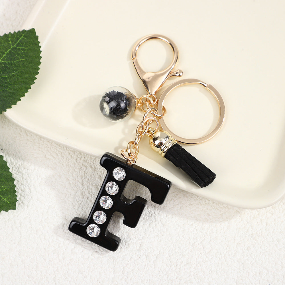 Llavero de resina negra con letras de diamantes de imitación, accesorio de arte moderno