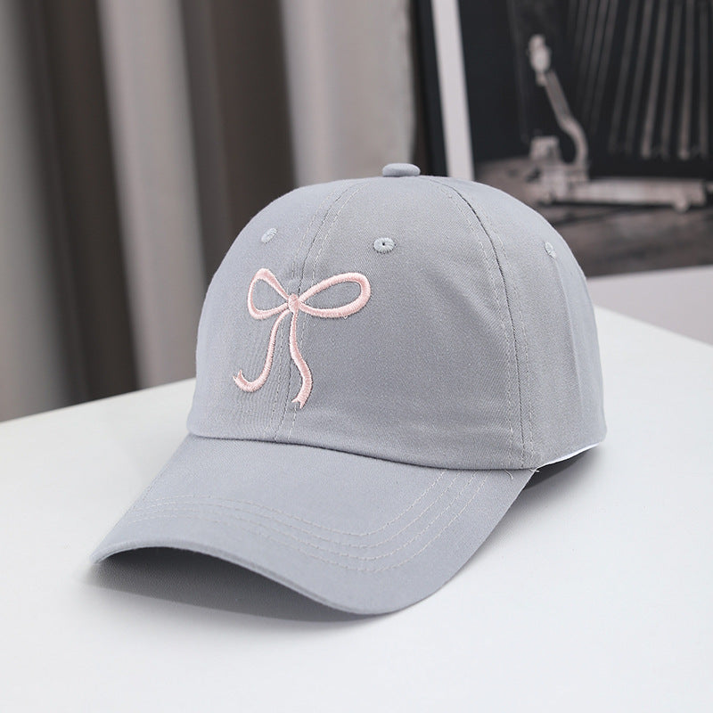 Gorra de béisbol con lazo bordado de color liso para mujer