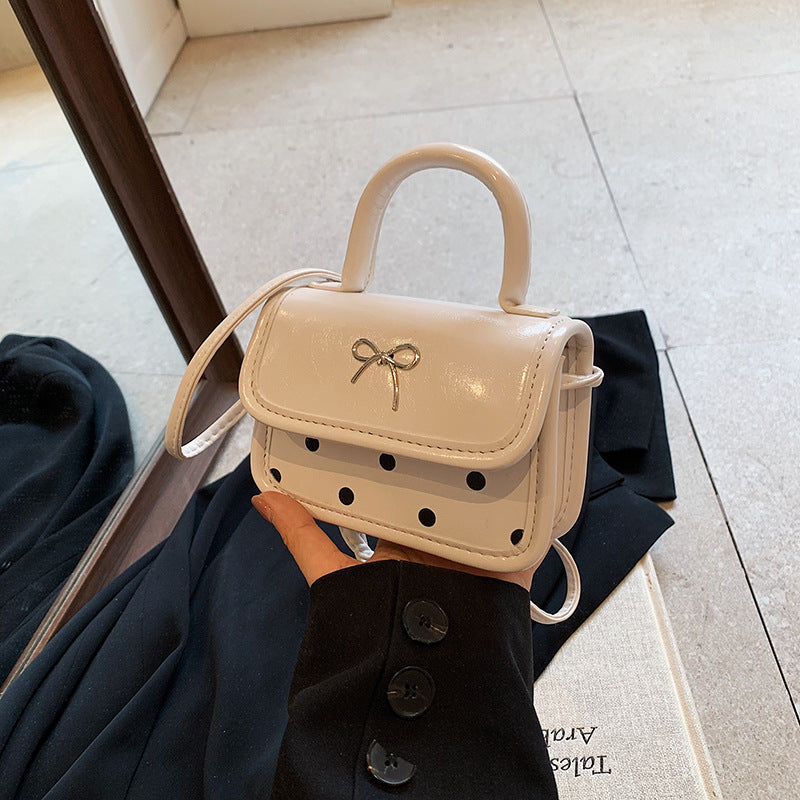 Mini bolso bandolera cuadrado con lazo de moda