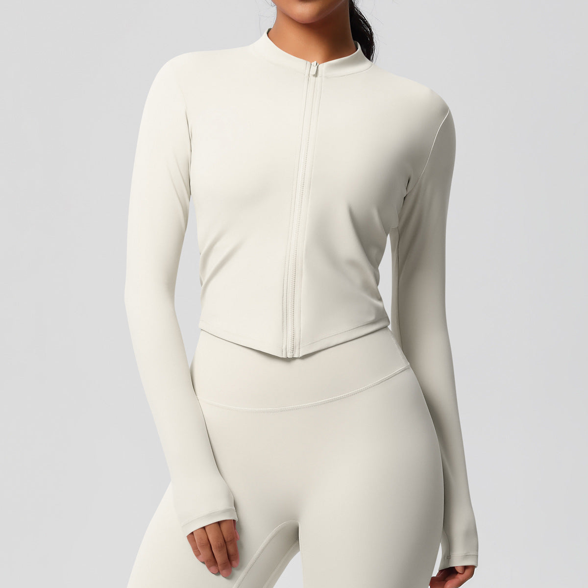 Top deportivo de manga larga de color liso a la moda para mujer
