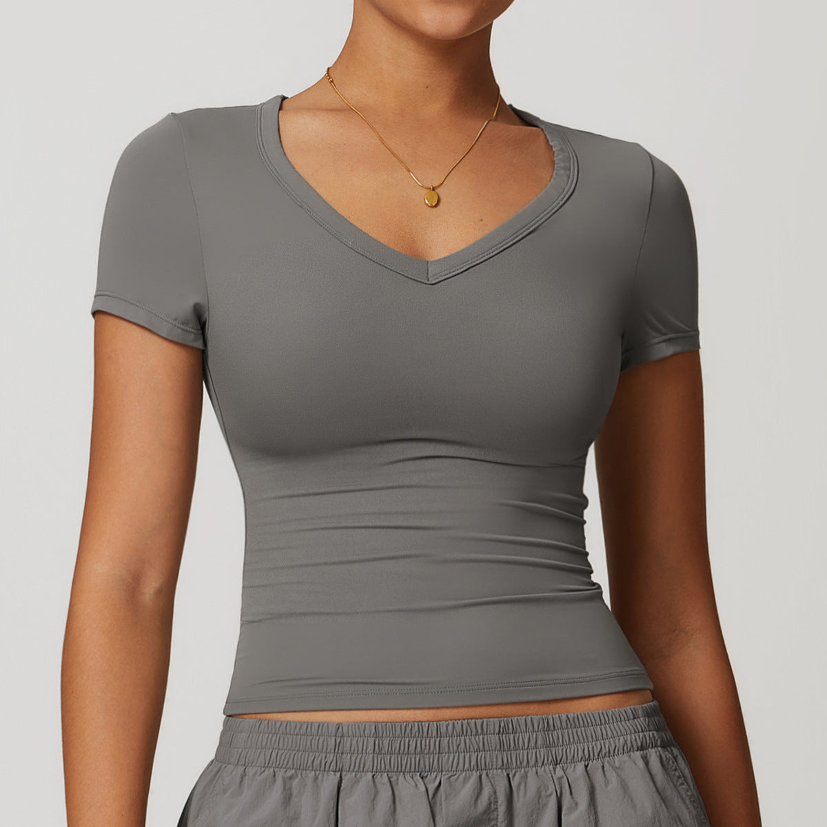 Camiseta de yoga informal de color liso con cuello en V para mujer