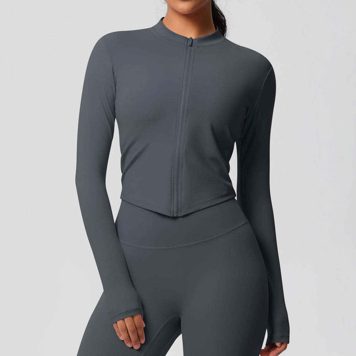 Top deportivo de manga larga de color liso a la moda para mujer