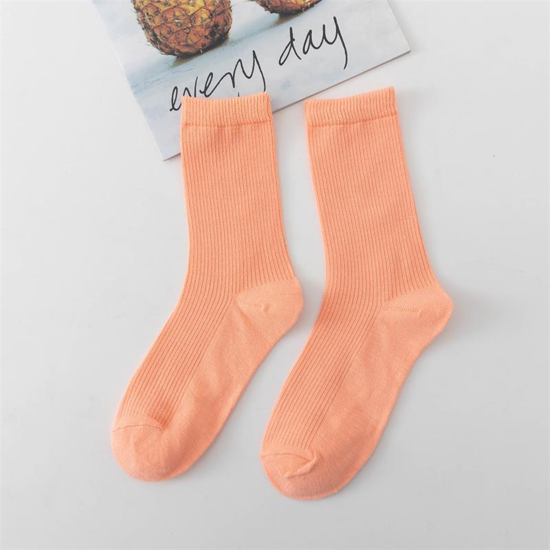 Calcetines de tubo de color liso sencillos a la moda para mujer