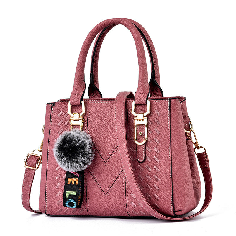 Bolso de mano informal con bola de pelo de color liso para mujer