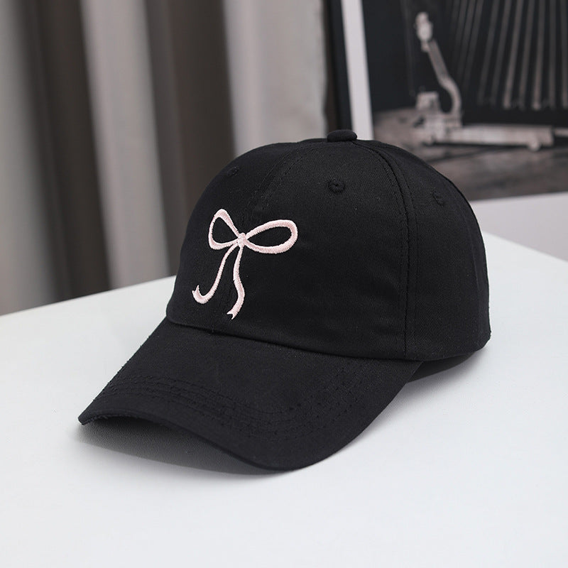 Gorra de béisbol con lazo bordado de color liso para mujer