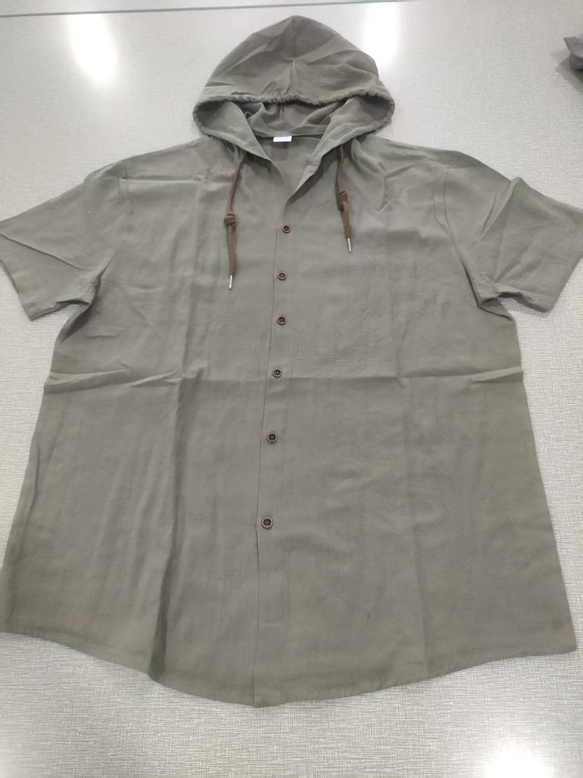 Sudadera con capucha informal de algodón y lino de manga corta para hombre, tendencia que combina con todo.