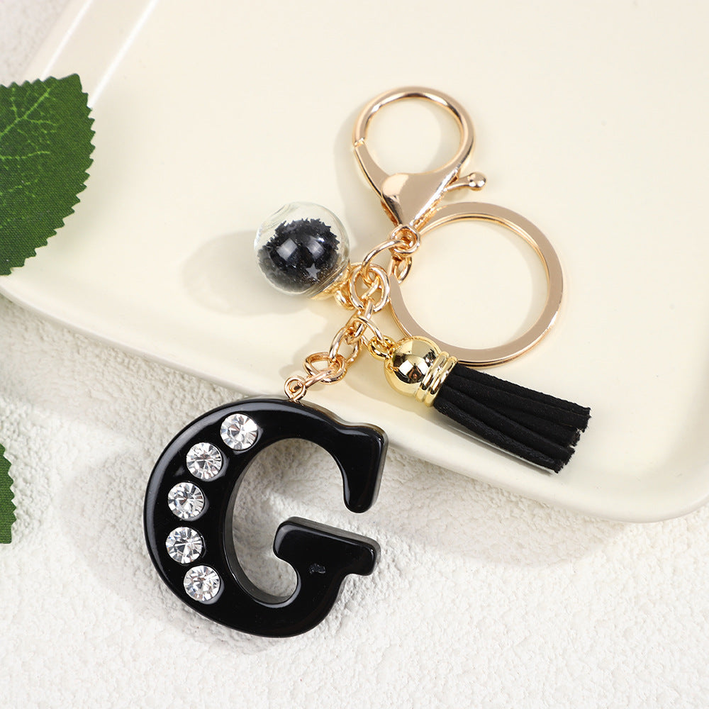Llavero de resina negra con letras de diamantes de imitación, accesorio de arte moderno