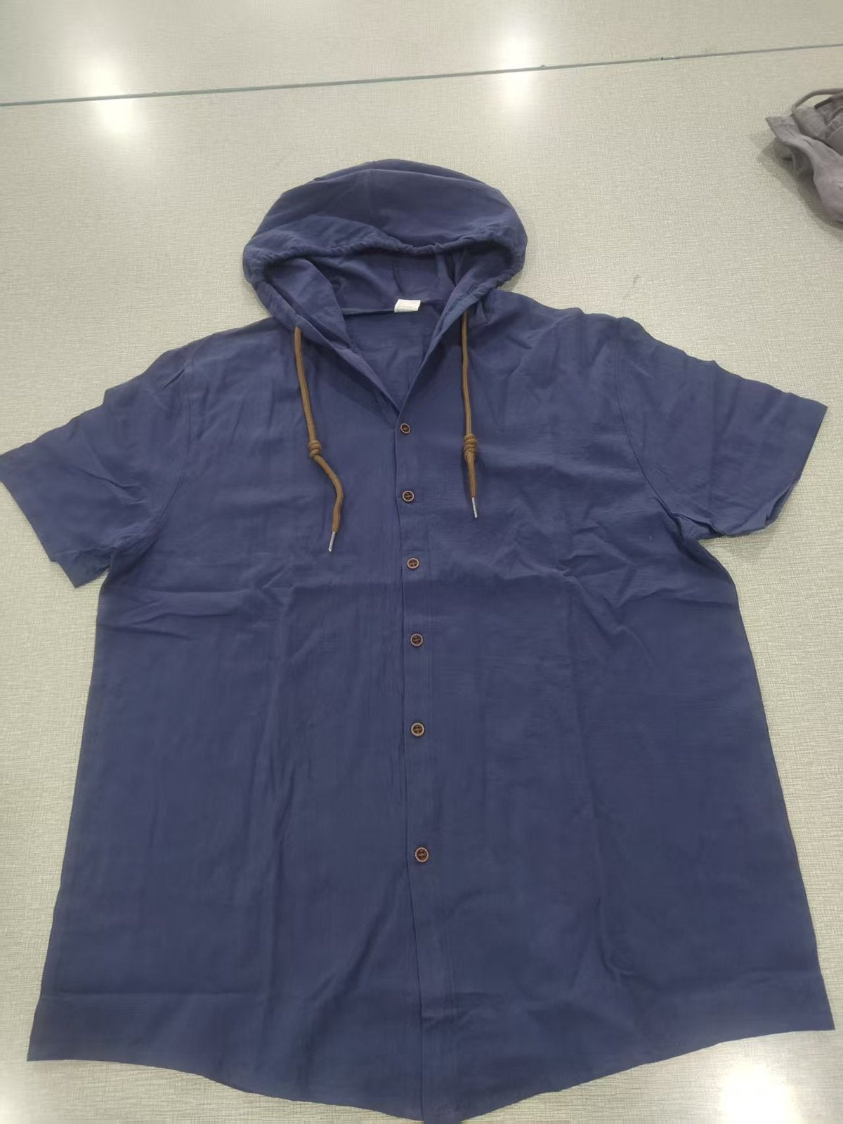 Sudadera con capucha informal de algodón y lino de manga corta para hombre, tendencia que combina con todo.