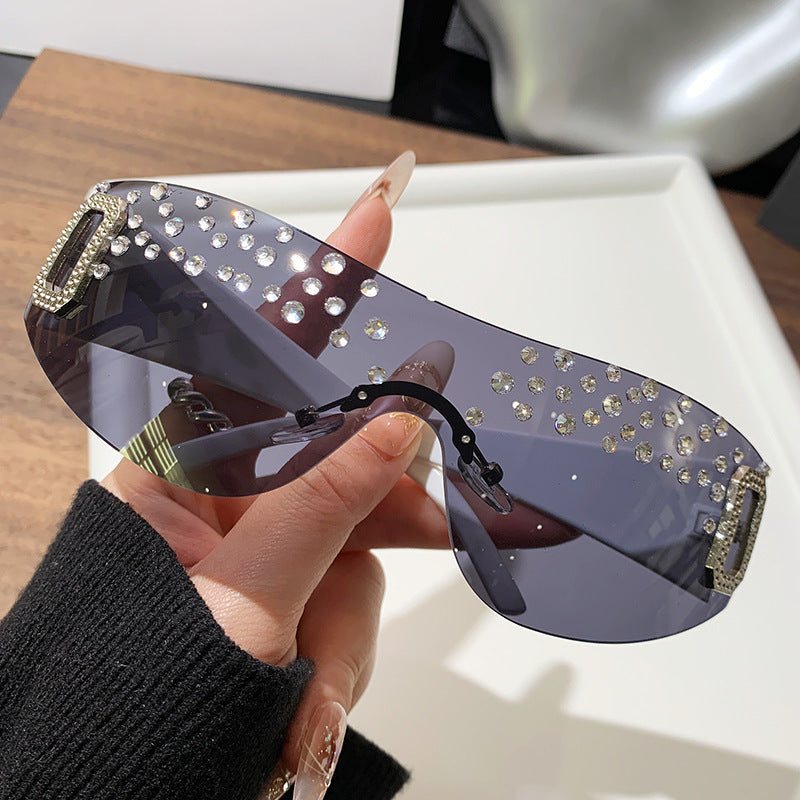 Gafas de sol de moda sin marco de un solo cuerpo con diamantes de imitación