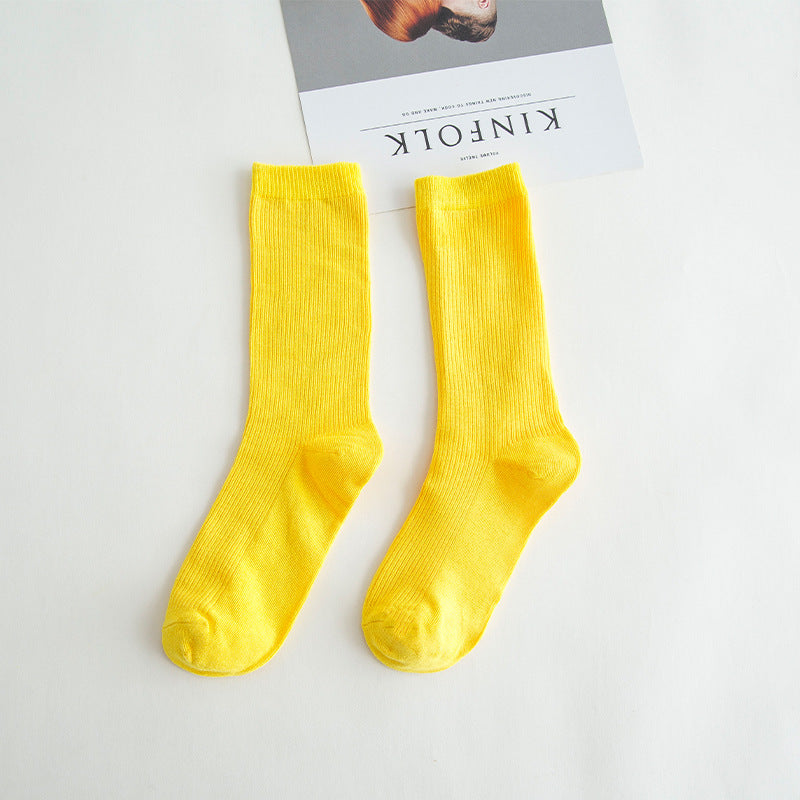 Calcetines de tubo de color liso sencillos a la moda para mujer