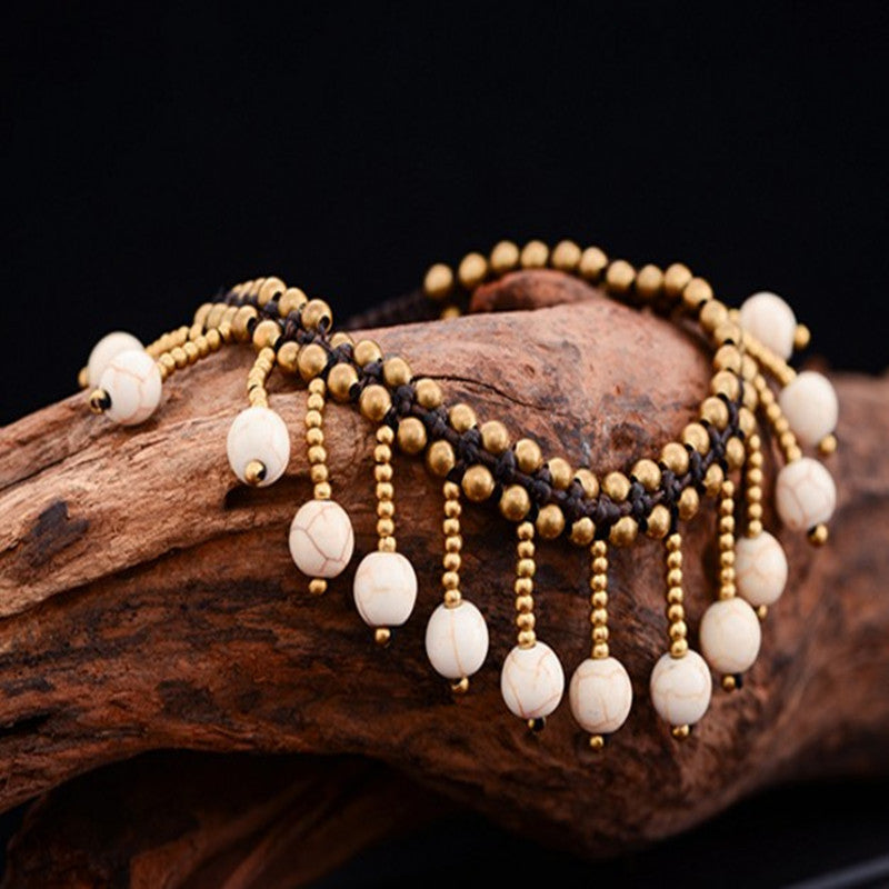 Tobillera bohemia con borlas trenzadas hechas a mano