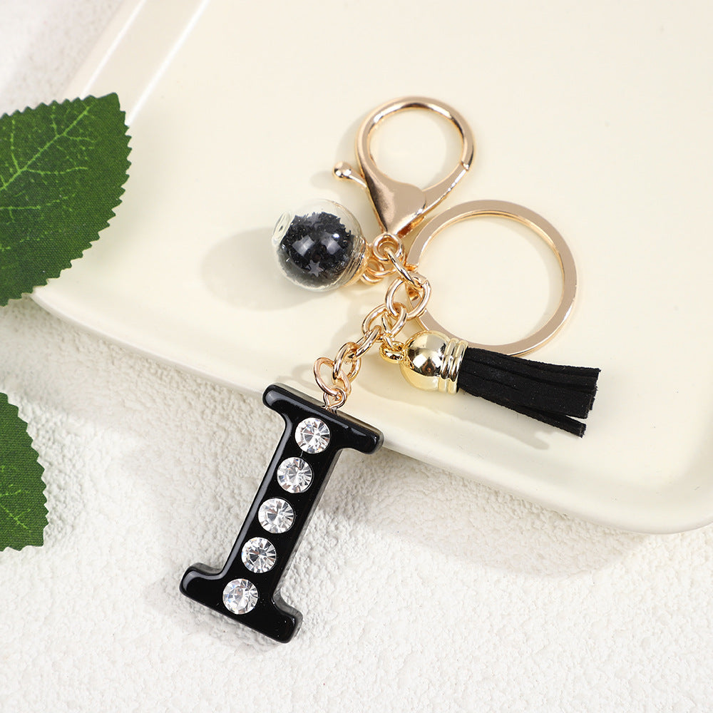 Llavero de resina negra con letras de diamantes de imitación, accesorio de arte moderno