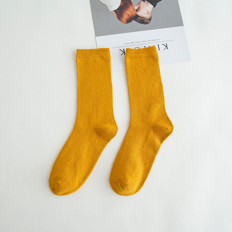 Calcetines de tubo de color liso sencillos a la moda para mujer