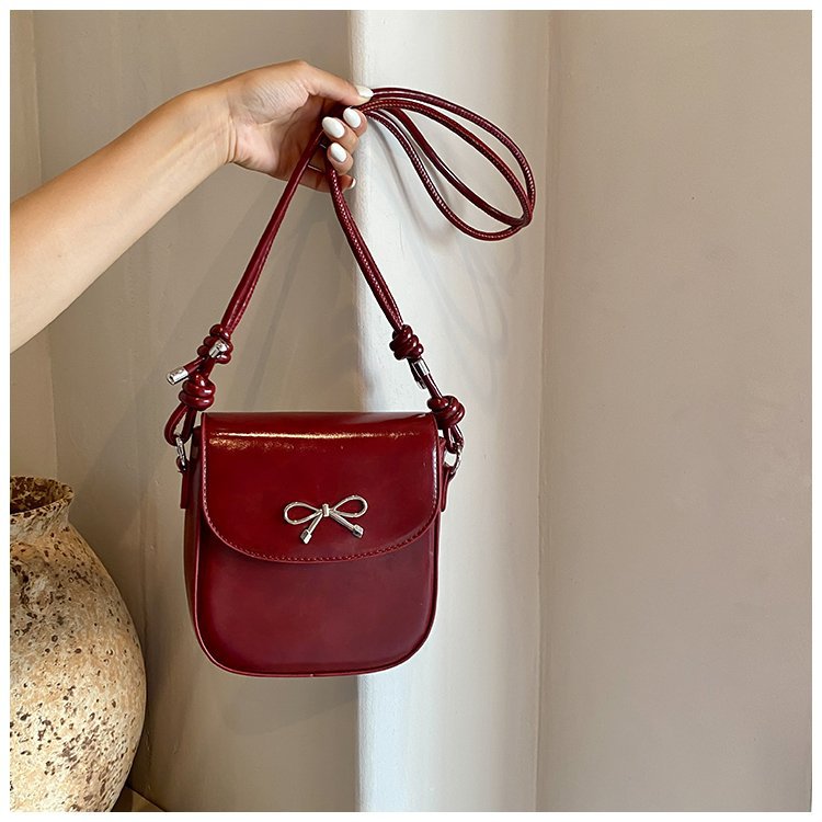 Mini bolso bandolera con lazo de color liso a la moda