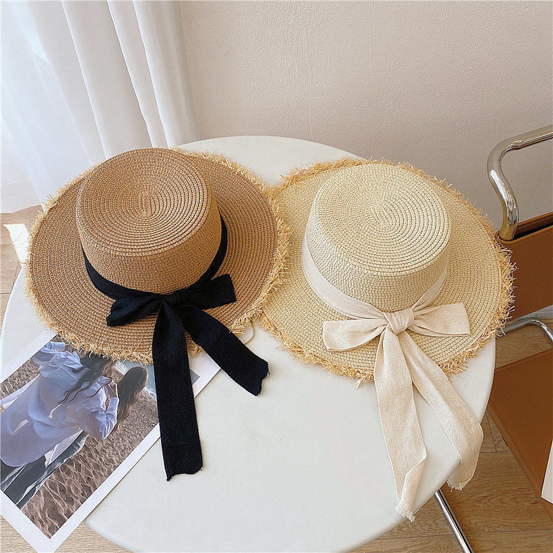 Sombrero de paja para el sol con parte superior plana y lazo para vacaciones en la playa