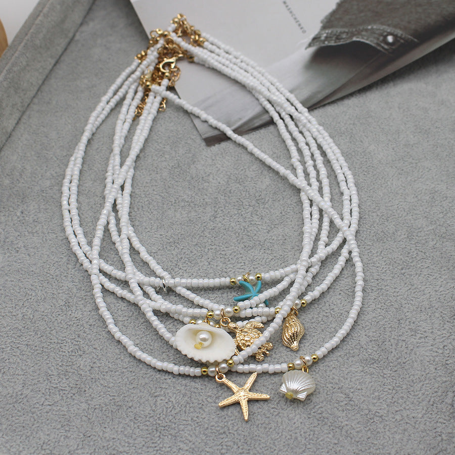 Collar con colgante de estrella de mar y cuentas de moda para mujer con detalles de aleación.