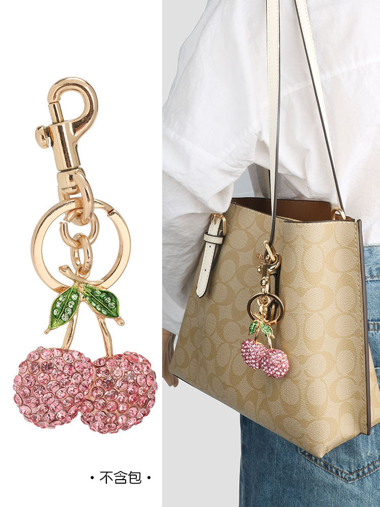 Llavero con colgante de cereza y diamantes de imitación rosas para mujer