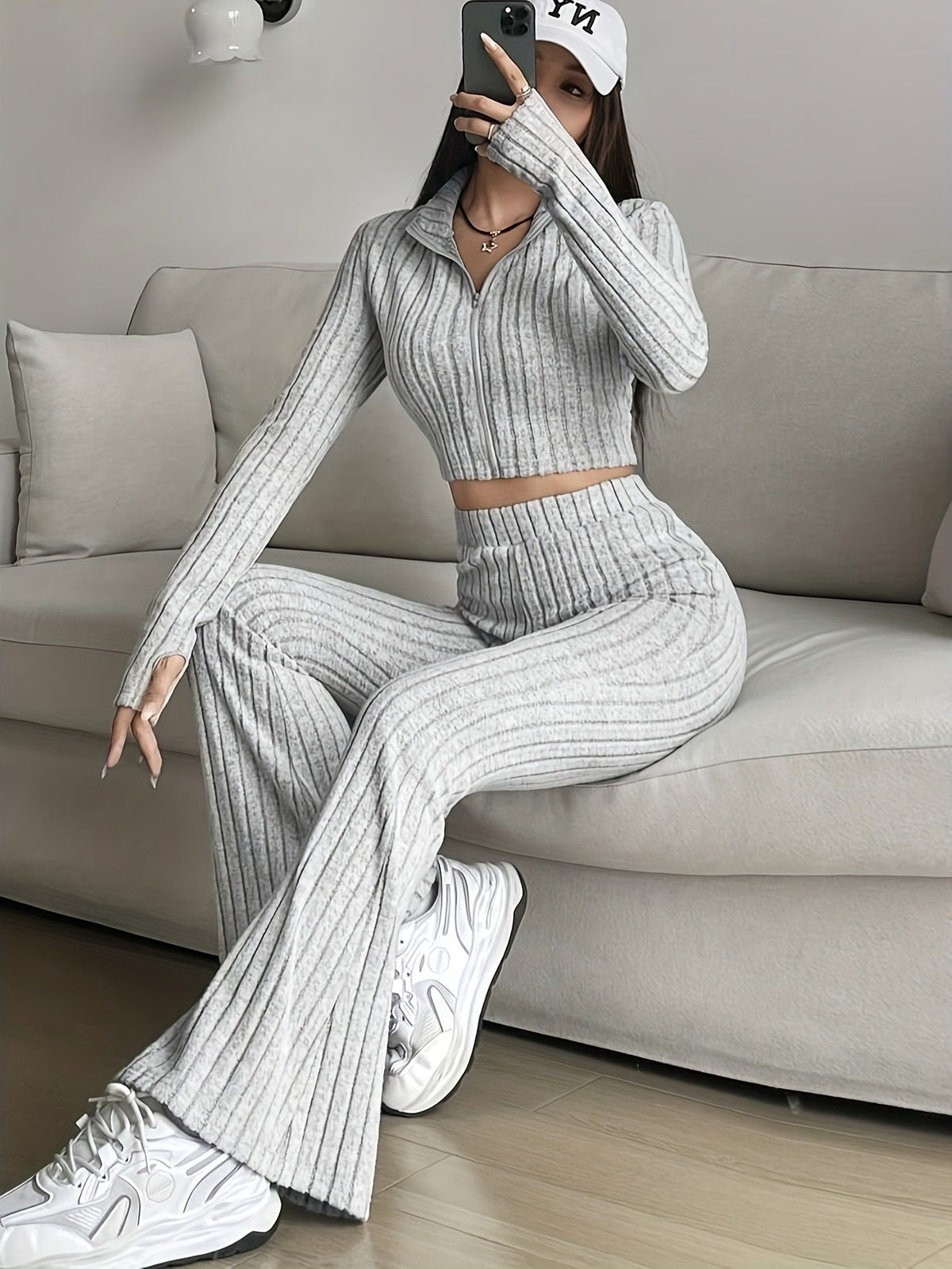 Conjunto de top y pantalón de manga larga con cremallera informal a la moda para mujer