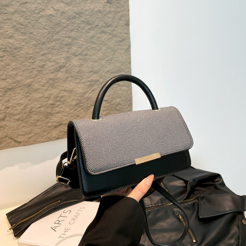Bolso de mano con costuras abatibles de moda - Tendencia urbana