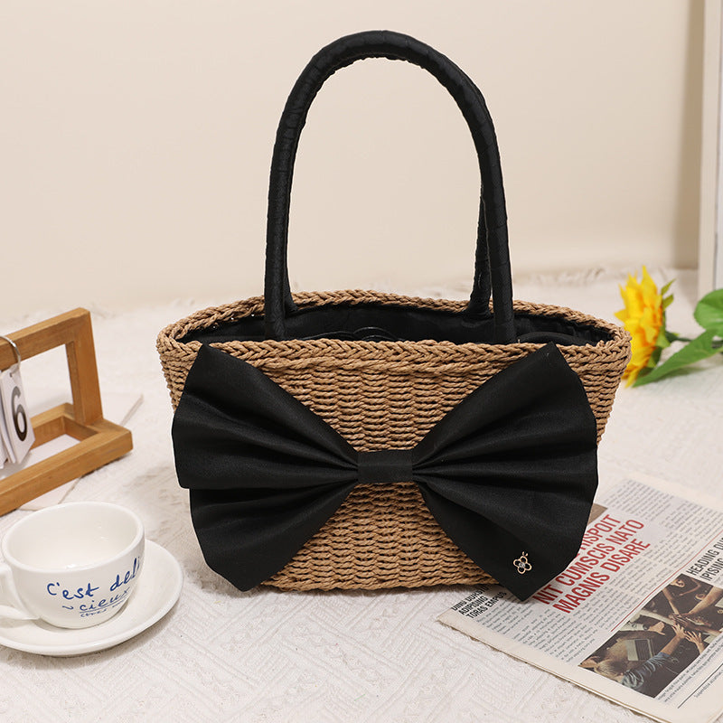 Bolso de mano tejido de paja con lazo bohemio