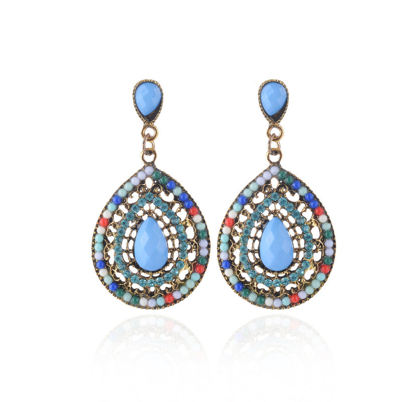 Pendientes colgantes con piedras preciosas huecas de estilo bohemio para mujer