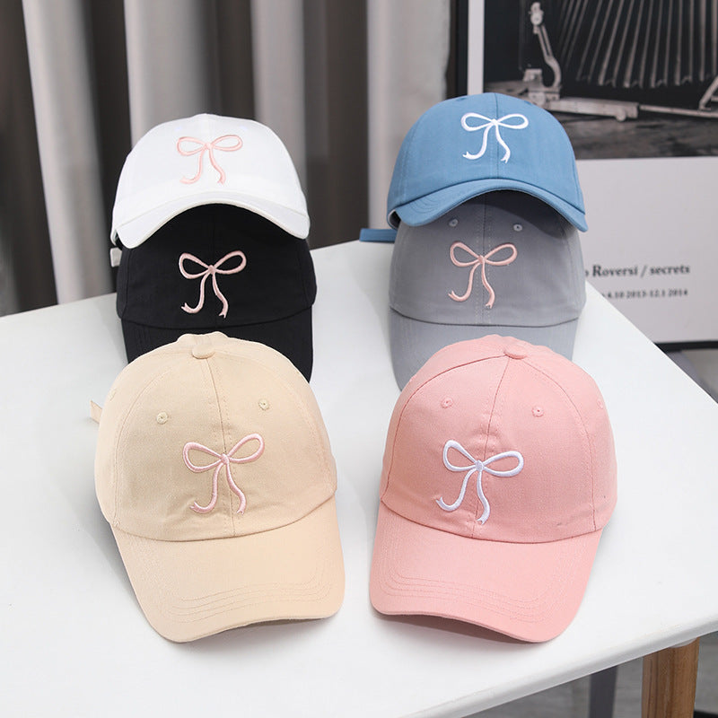 Gorra de béisbol con lazo bordado de color liso para mujer