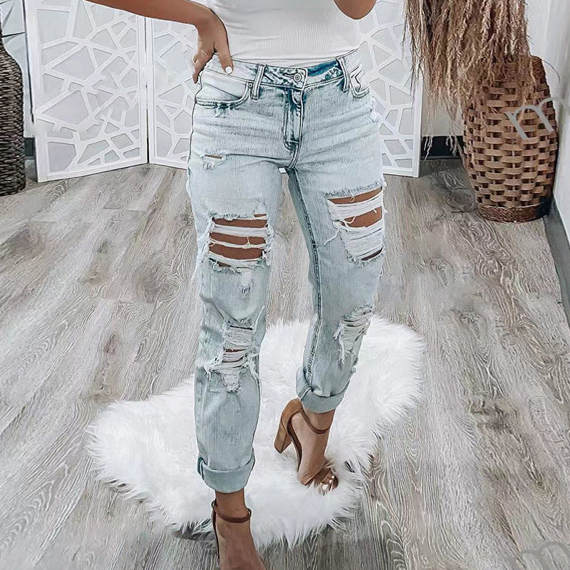 Vaqueros rotos ajustados de moda para mujer