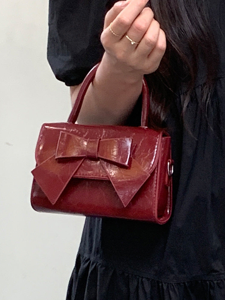Bolso de mano pequeño cuadrado con lazo de color liso elegante para mujer