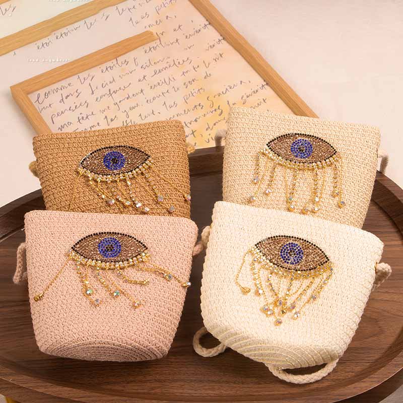 Bolso bandolera informal de paja con diseño de ojo malvado para niñas