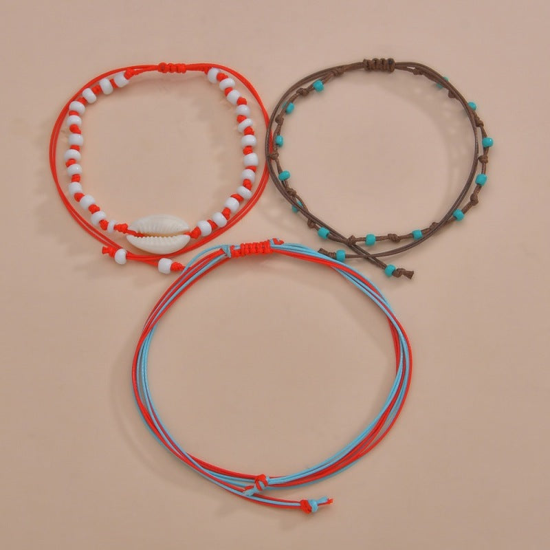 Conjunto de tobilleras bohemias multicapa con cuentas de concha
