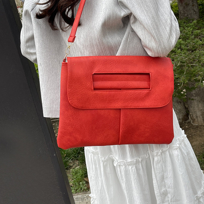 Bolso de mano tipo sobre de color liso para mujer, sencillo y moderno.