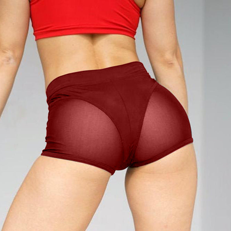 Pantalones cortos deportivos casuales de malla con costuras de color sólido para mujer