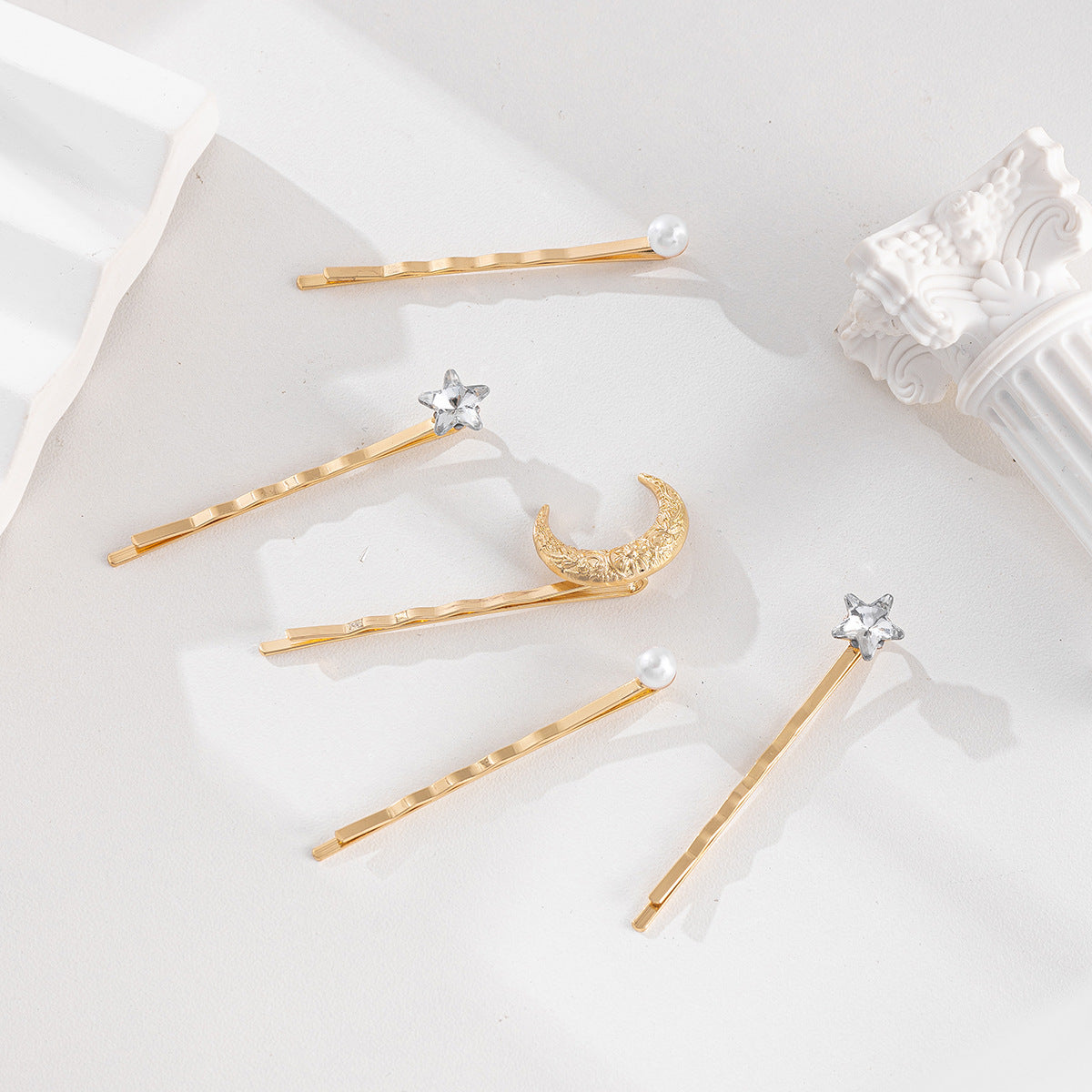 Pince à cheveux tendance en forme d'étoile avec strass et perles pour femme
