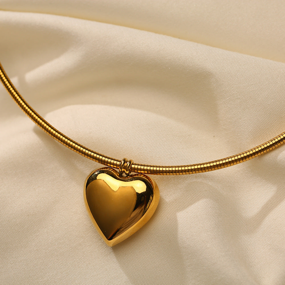 Collar circular sencillo de acero y titanio con forma de corazón de 18 quilates para mujer