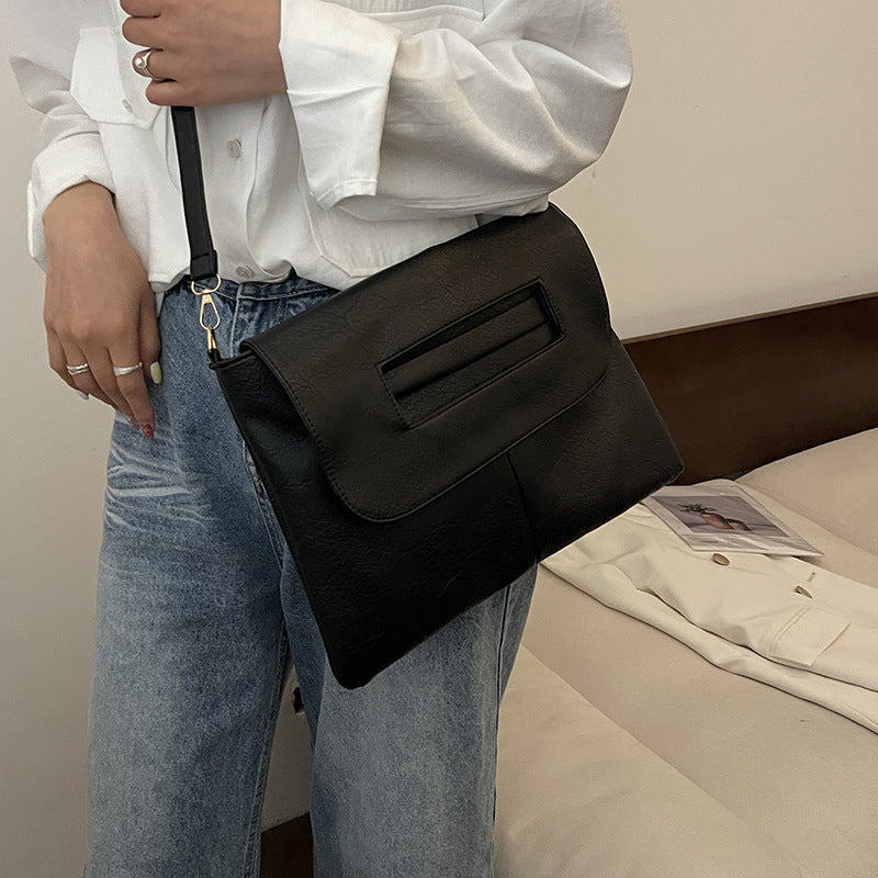Bolso de mano tipo sobre de color liso para mujer, sencillo y moderno.
