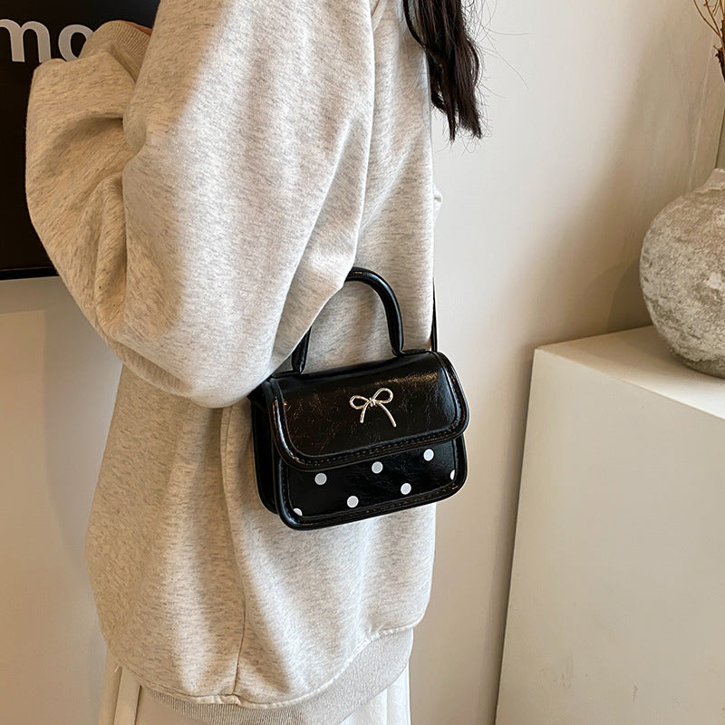 Mini bolso bandolera cuadrado con lazo de moda