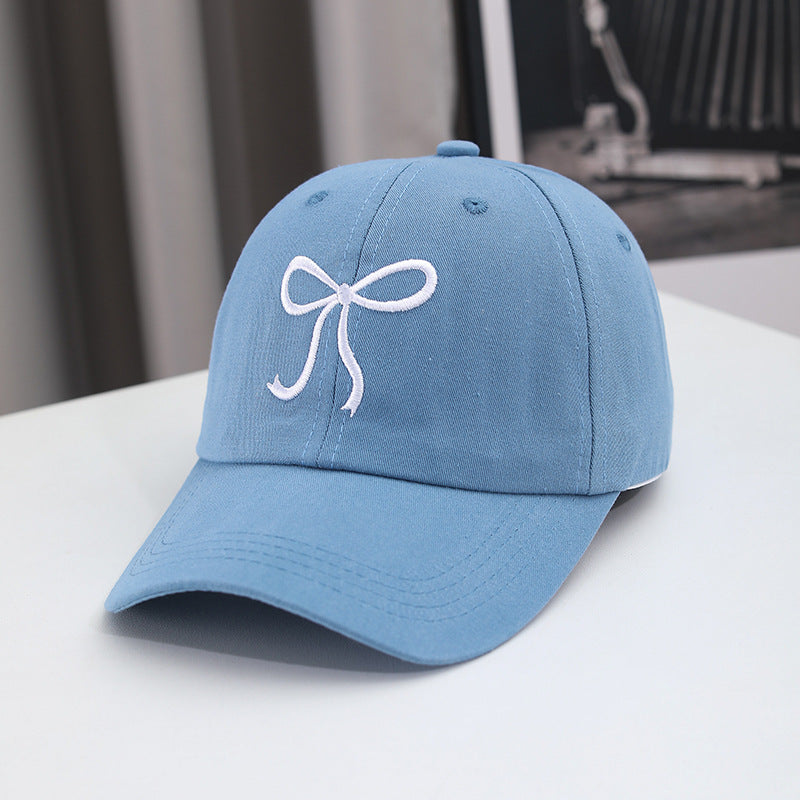 Gorra de béisbol con lazo bordado de color liso para mujer