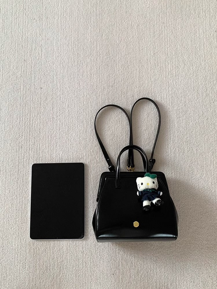 Bolso de mano retro informal de piel encerada negra para mujer