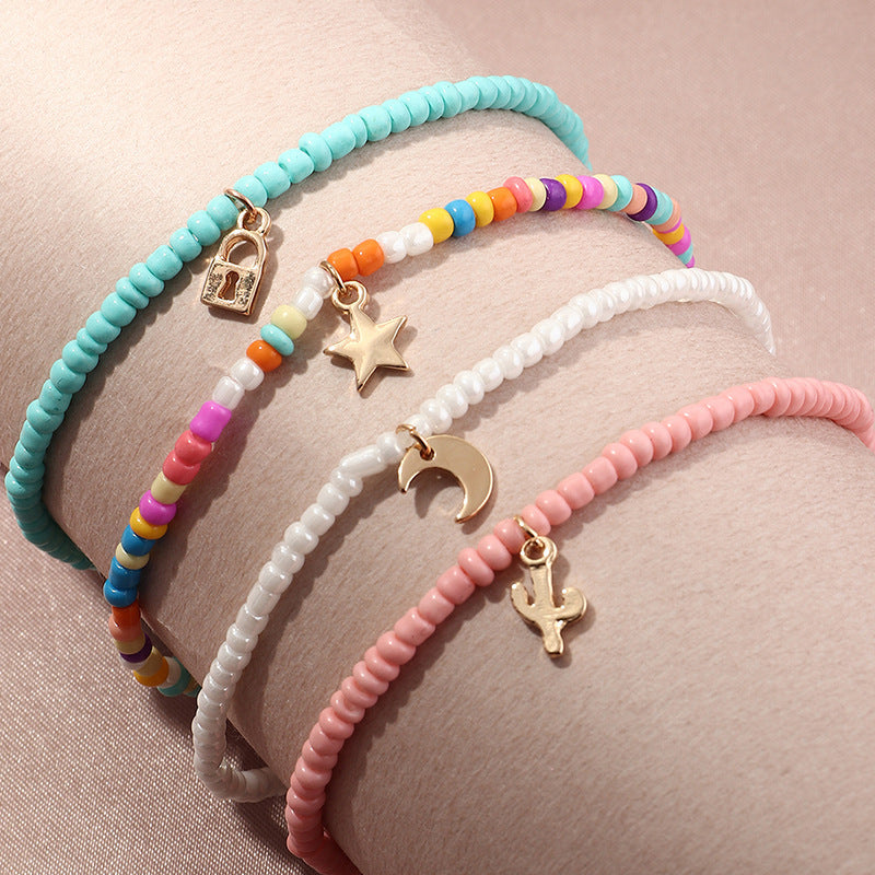 Conjunto de tobillera con cuentas multicolores bohemias y estrella creciente