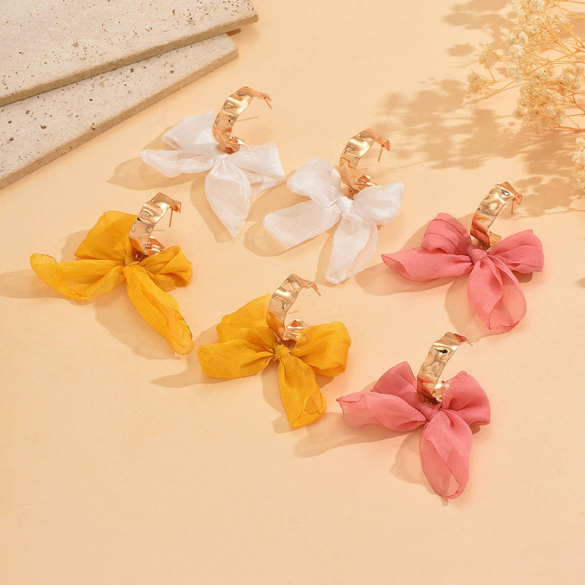 Boucles d'oreilles bohèmes en cuivre avec nœud pour les fêtes