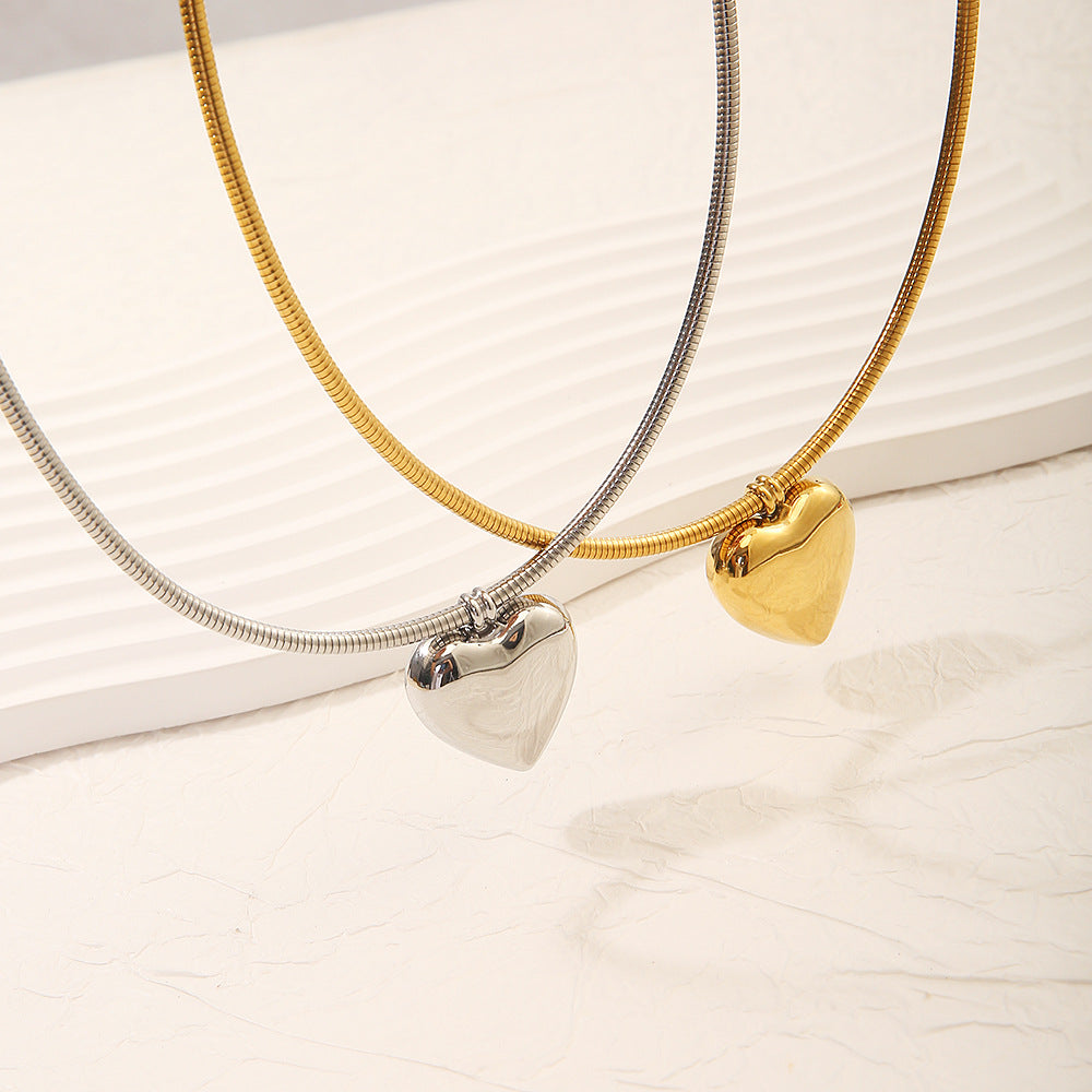 Collar circular sencillo de acero y titanio con forma de corazón de 18 quilates para mujer