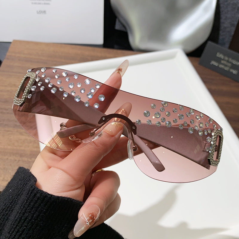 Gafas de sol de moda sin marco de un solo cuerpo con diamantes de imitación