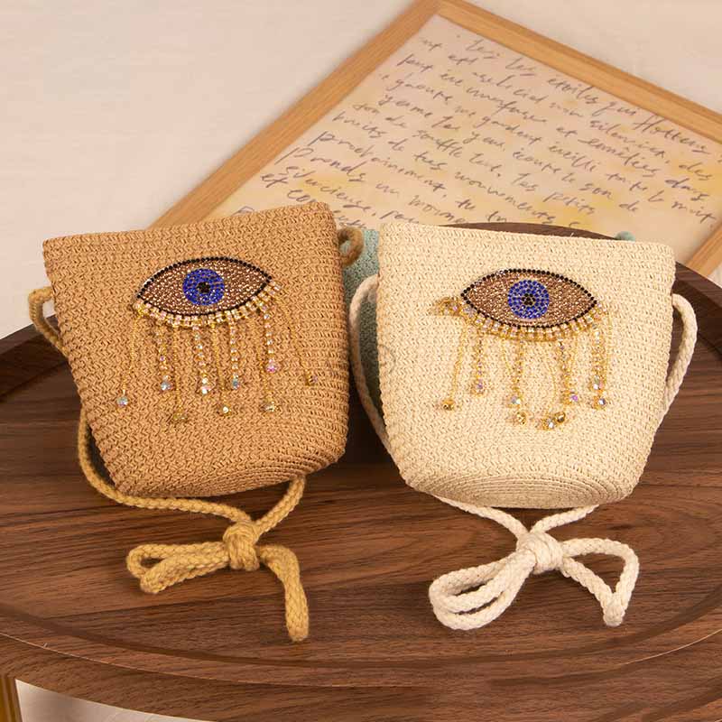 Bolso bandolera informal de paja con diseño de ojo malvado para niñas