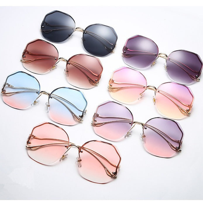 Gafas de sol sin marco con borde de arco metálico poligonal de moda