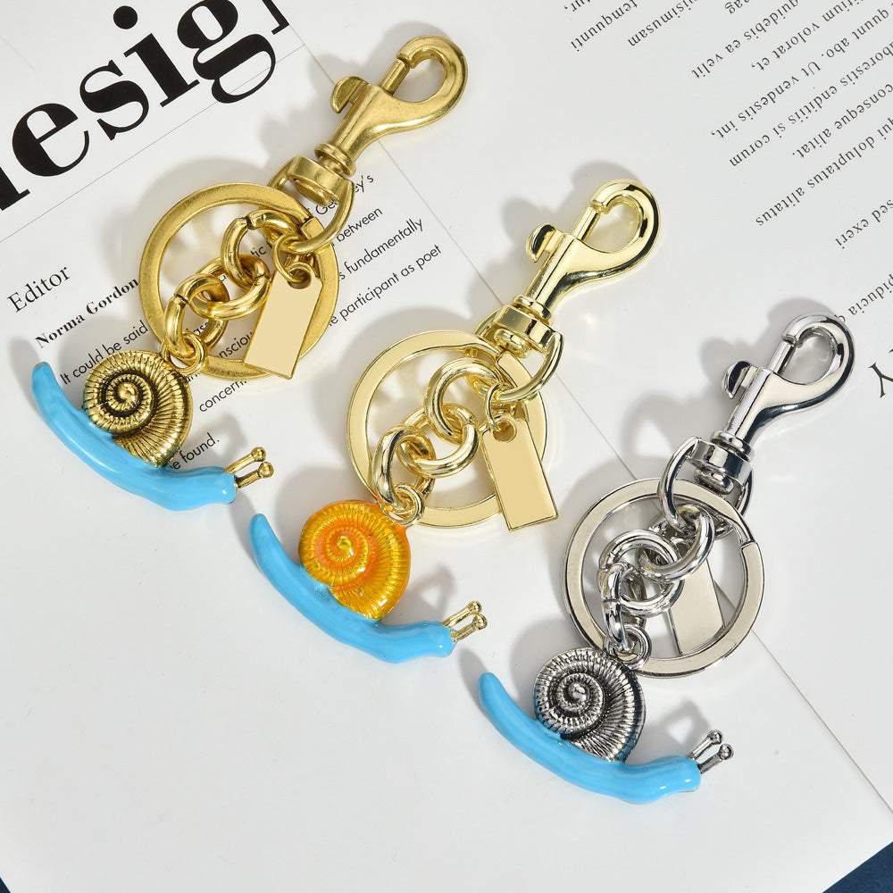Llavero con colgante de bolso de caracol de moda, aleación orgánica marina, accesorios de moda