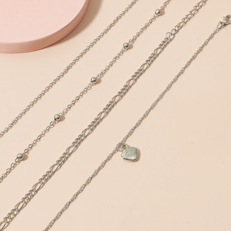 Conjunto de tobillera con cuentas multicapa y dije de corazón de Bohemia